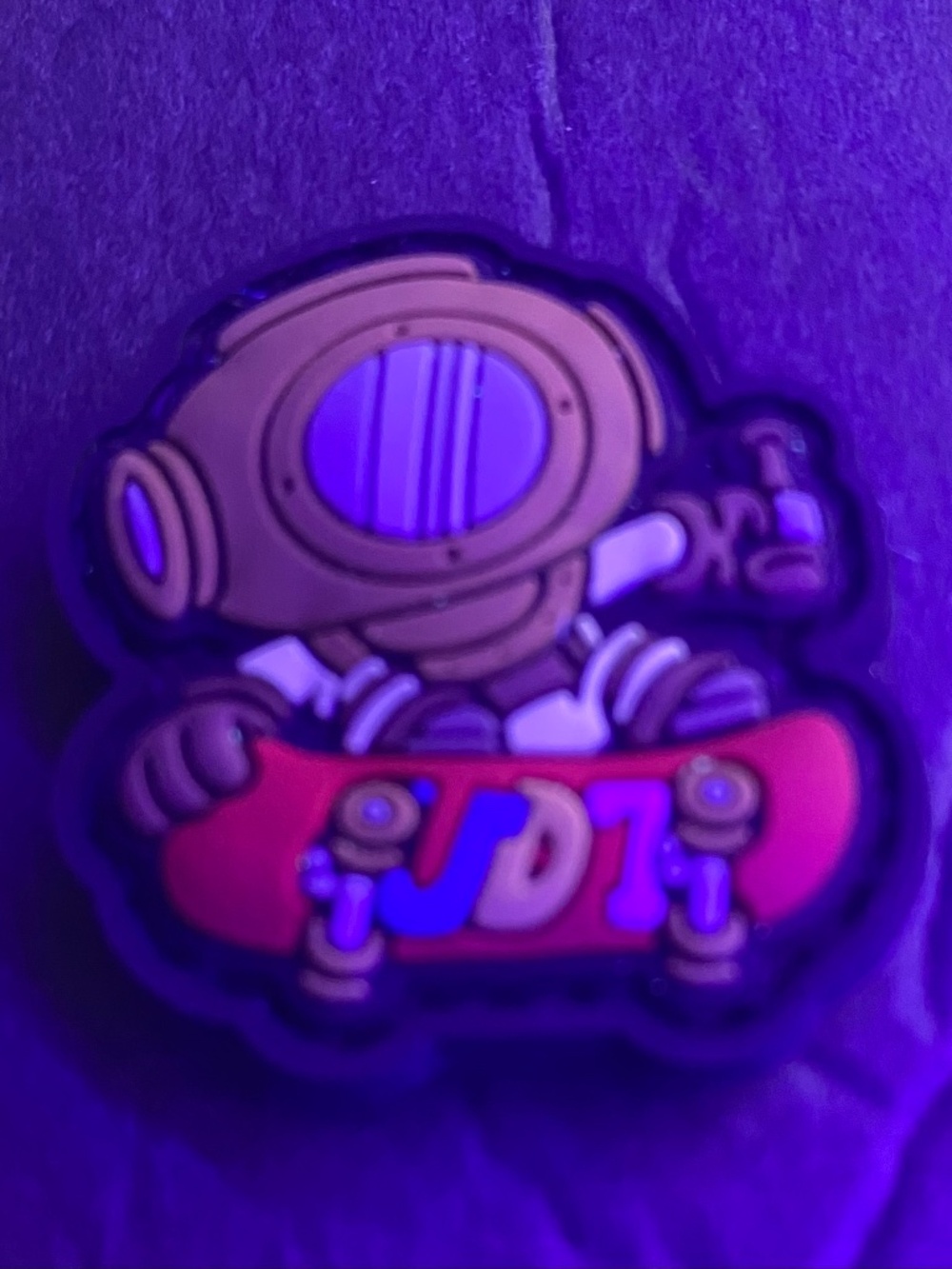 Deep sea, diving helmets, character riding a red skateboard. Patch.
